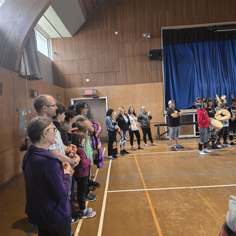 people with blankets at the QomQem seafood feast