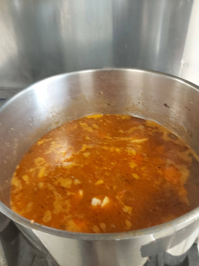 Hamburger soup in a large pot.